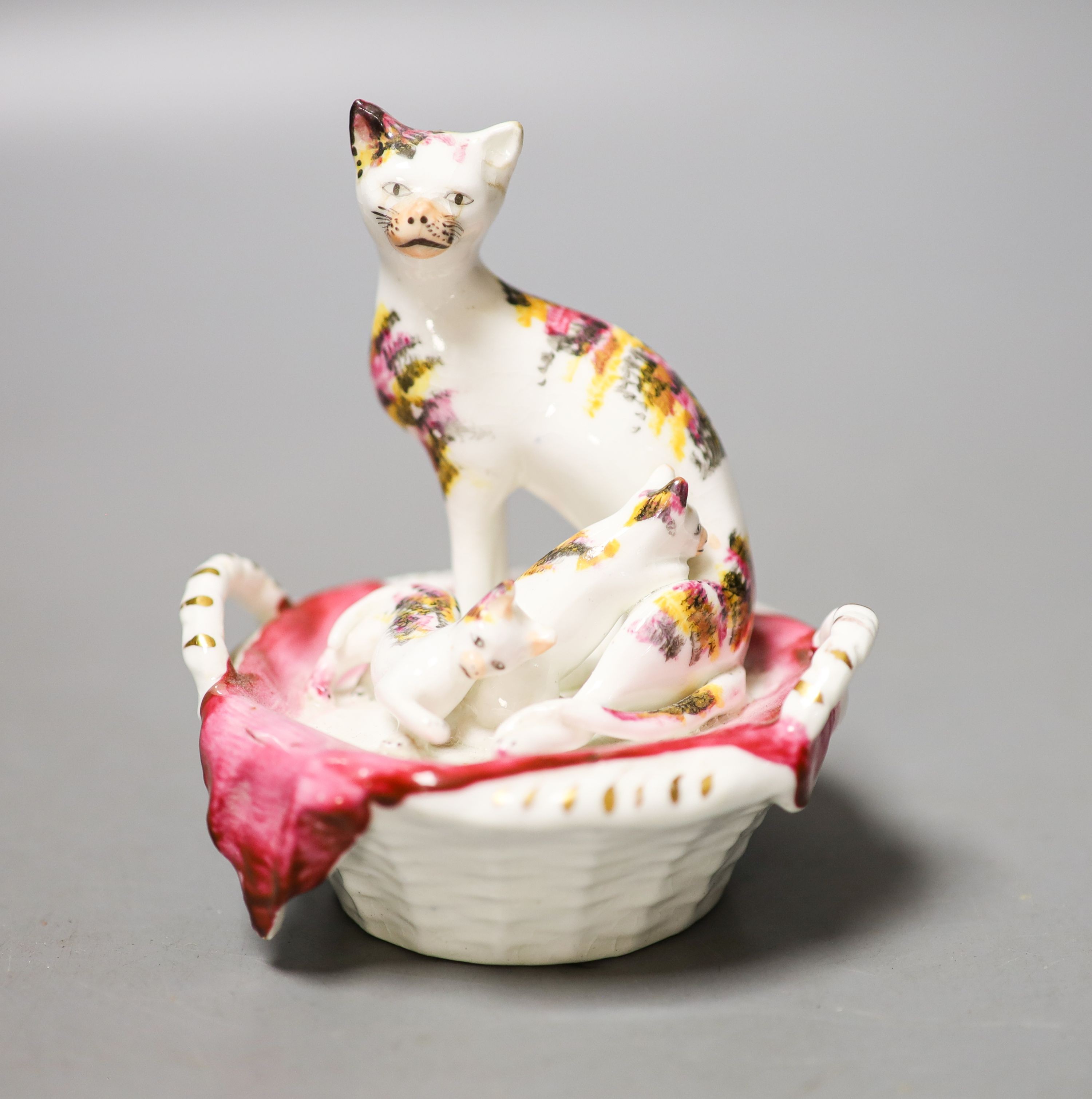 A Staffordshire porcelain group of a cat and kittens in a basket, c.1835-50 10cm